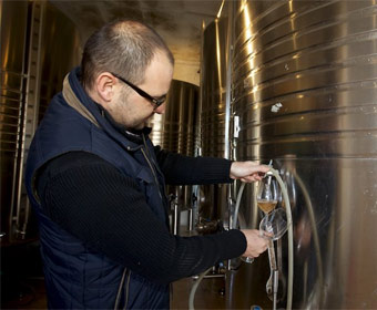 Laurent Fresard tasting the wine 